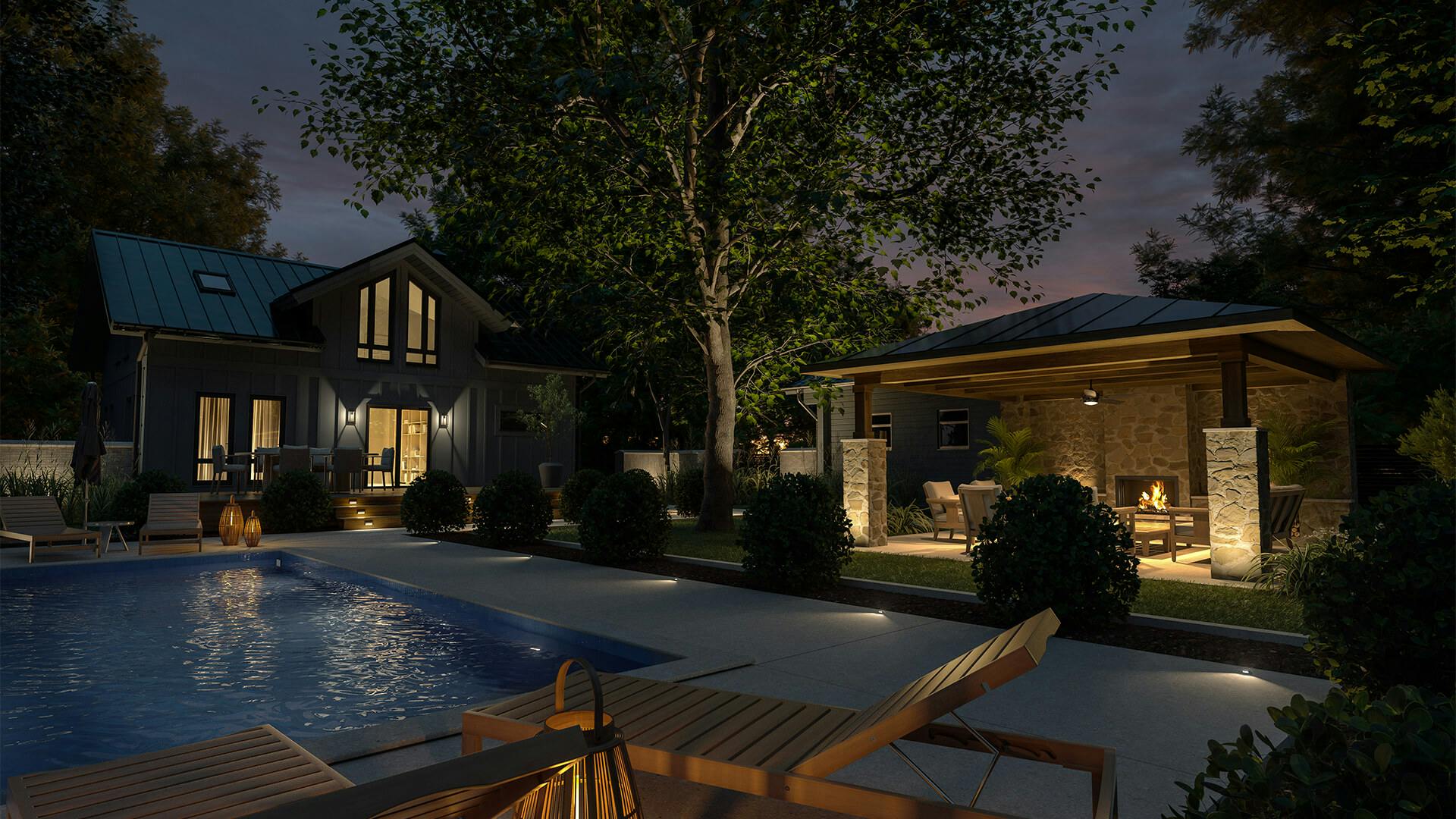 Exterior of stone home with pool and covered patio in the background with landscape accent lights