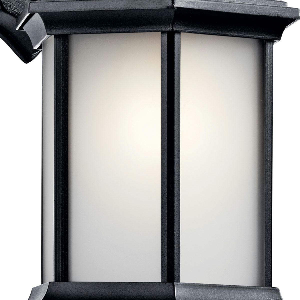 Close up view of the Chesapeake 11.75" Wall Light Glass Black on a white background