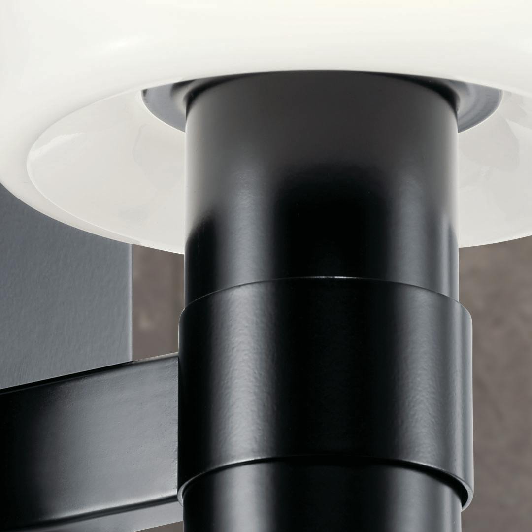 Close up view of the Adani 8.5 Inch 1 Light Vanity Light with Opal Glass in Black