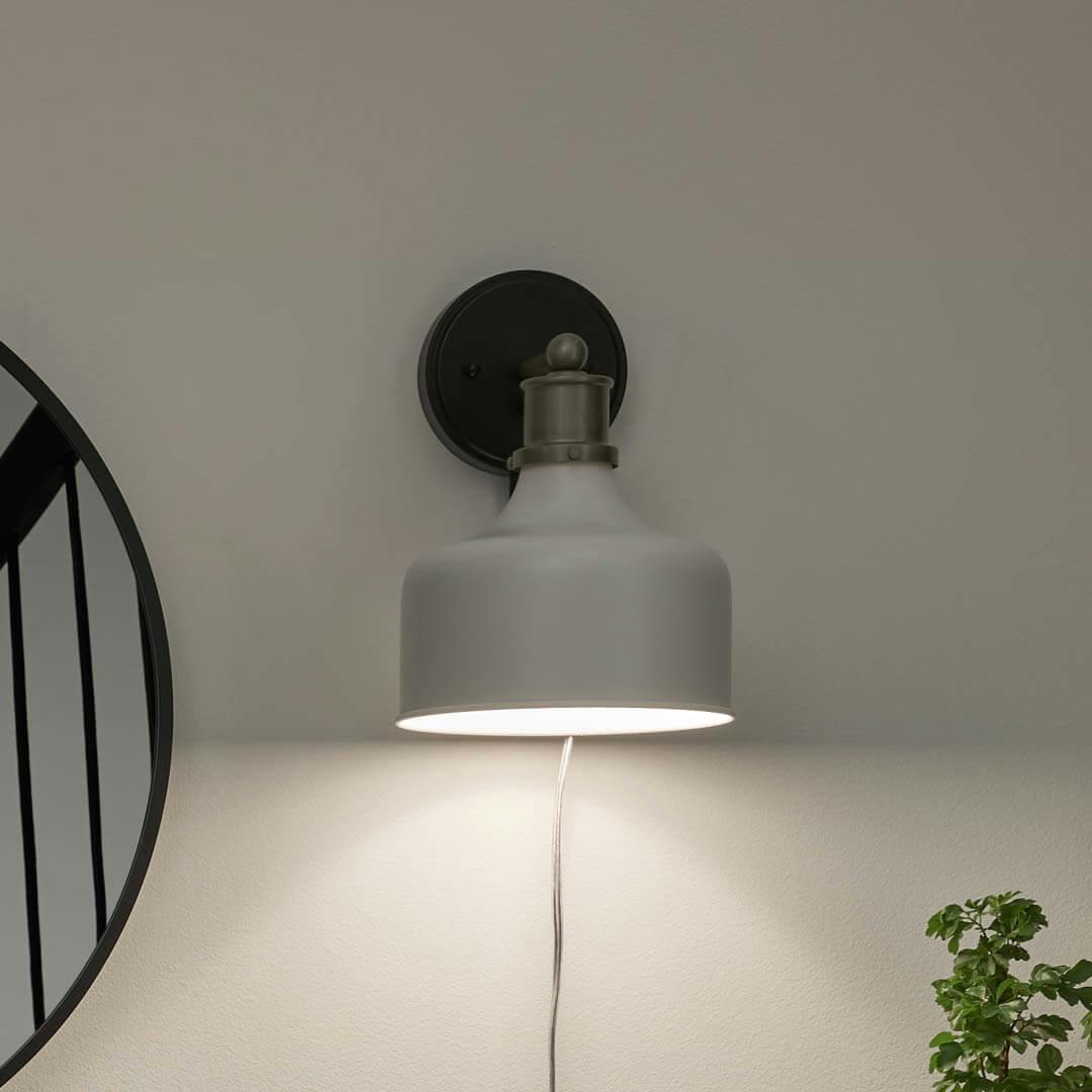 Night time entryway with Ernest 11 Inch 1 Light Plug-In Wall Sconce in Brushed Nickel and Matte Black
