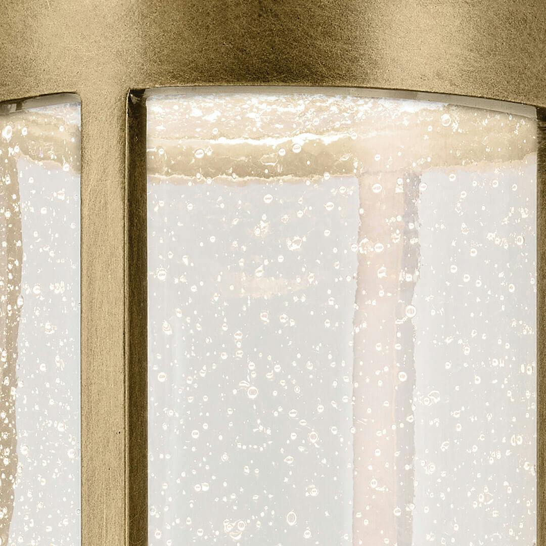 Close up view of the Camillo 22.5" LED Outdoor Post Light in Textured Black with Natural Brass on a white background