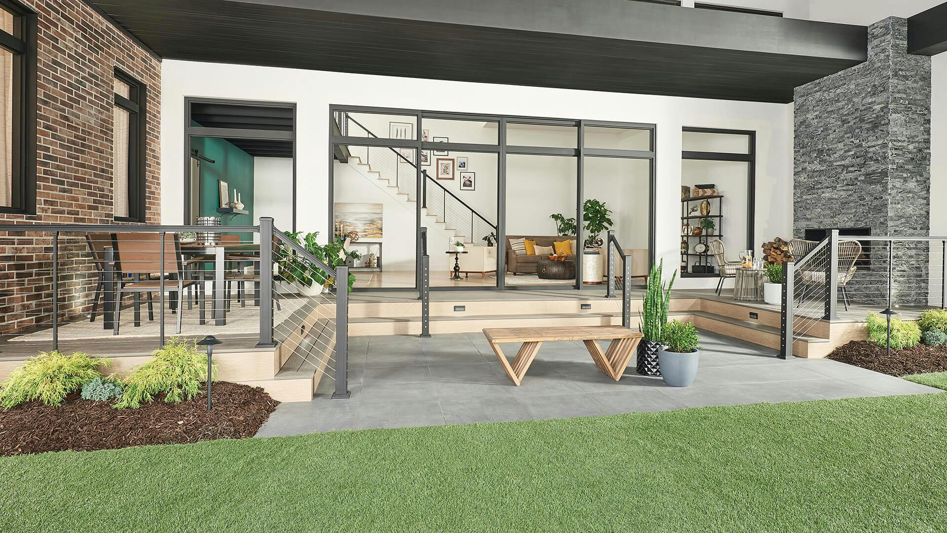 Patio yard space with view into home's living room during the day