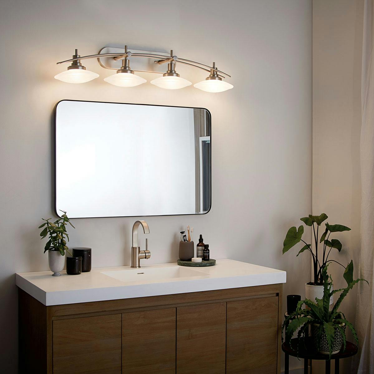 Night time bathroom image featuring Structures vanity light 6464NI