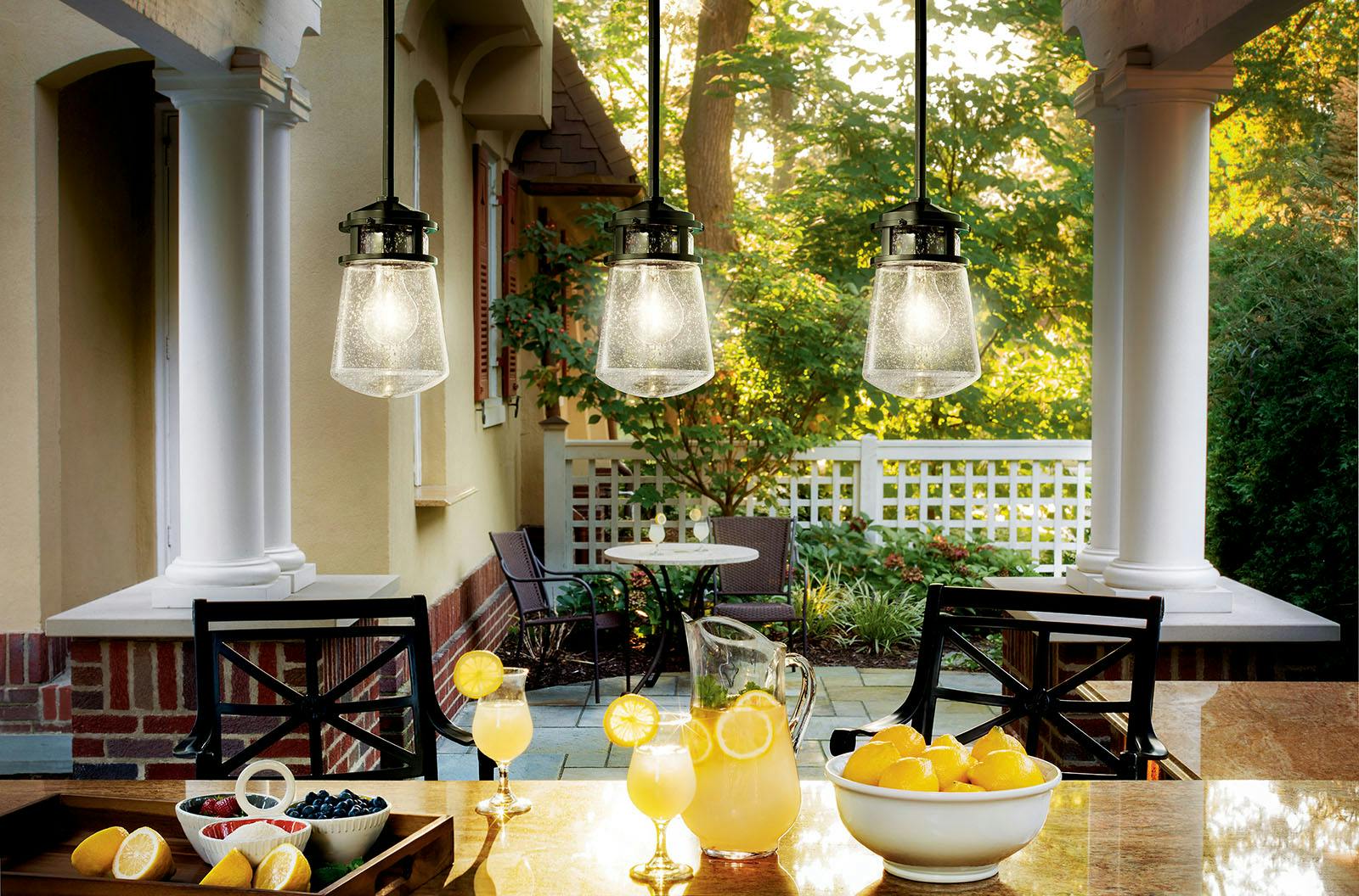 Outdoor dining with Lyndon™ 11.75" 1 Light Pendant with Clear Seeded Glass Architectural Bronze