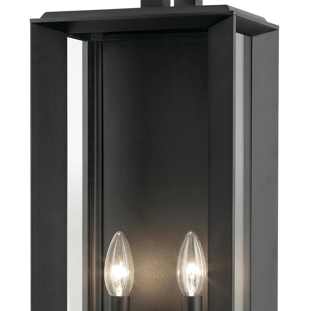 Close up view of the Kroft 28" 2 Light Outdoor Wall Light with Clear Glass in Textured Black on a white background