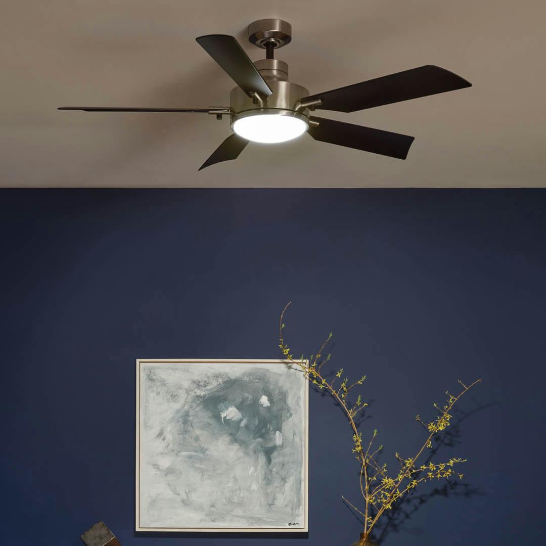 Night time living room with 56" Guardian LED Indoor Ceiling Fan Brushed Stainless Steel