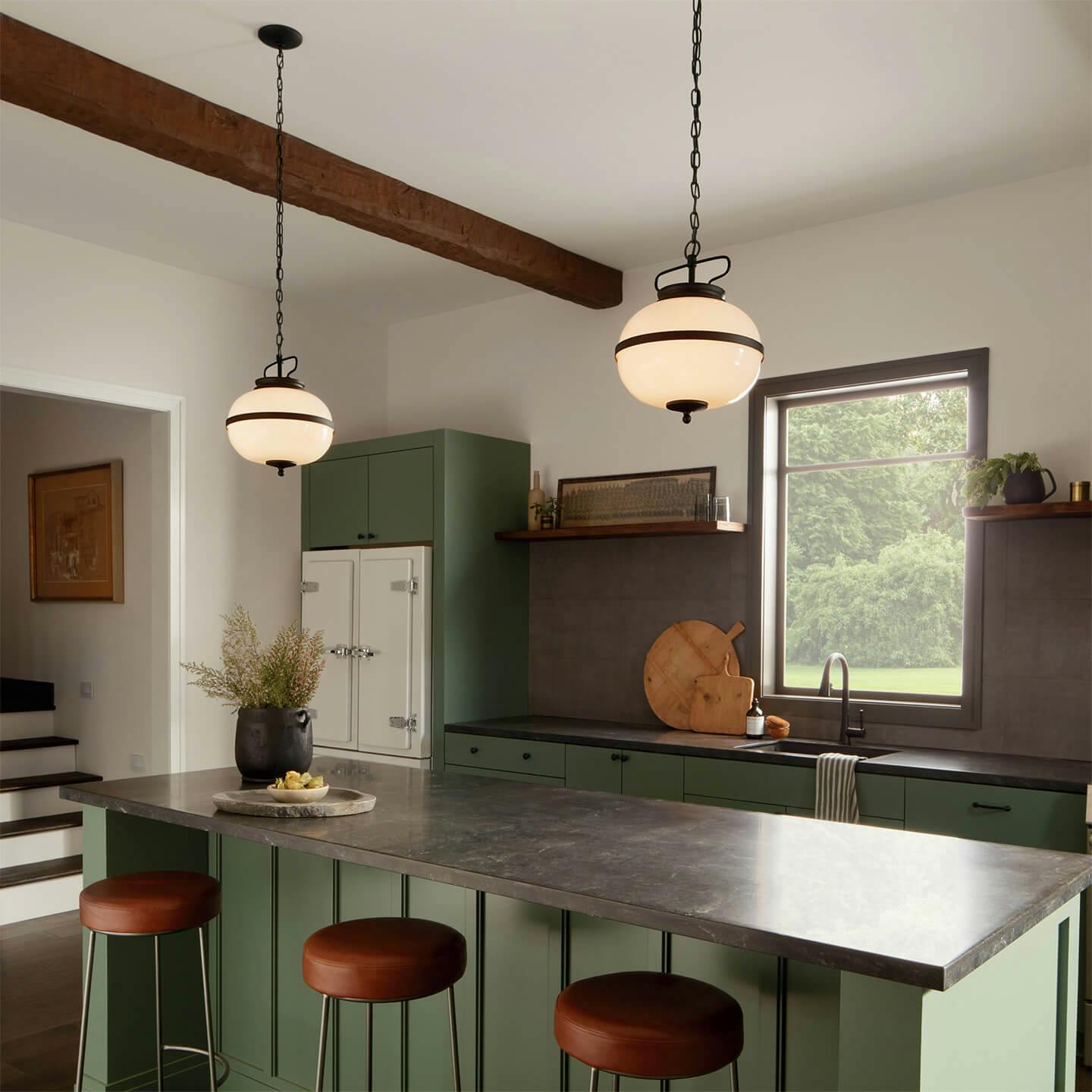 Opal pendants over kitchen island at daytime.