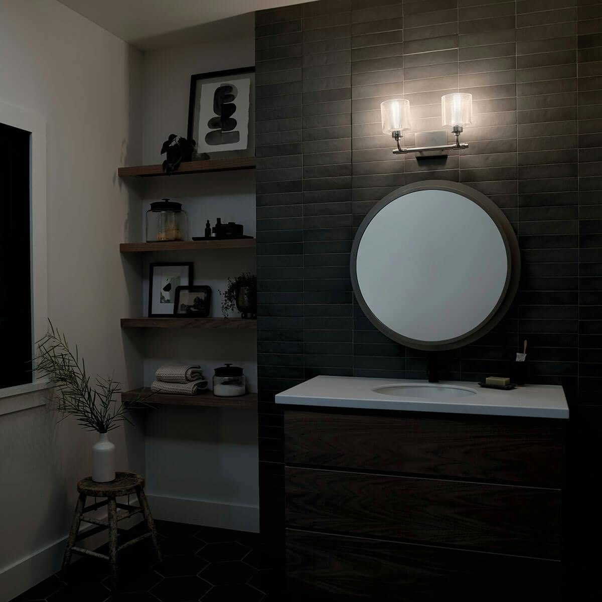 Night time Bathroom featuring Harvan vanity light 55106SN
