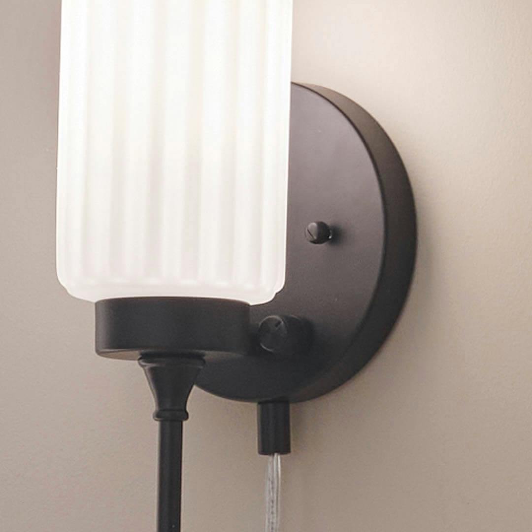 Day time bedroom with Thelma 16 Inch 1 Light Plug-In Wall Sconce with Satin-Etched Cased Opal Glass in Matte Black