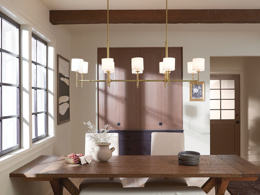 Day time dining room with Ali 56.5" 10 Light Linear Chandelier Brushed Natural Brass