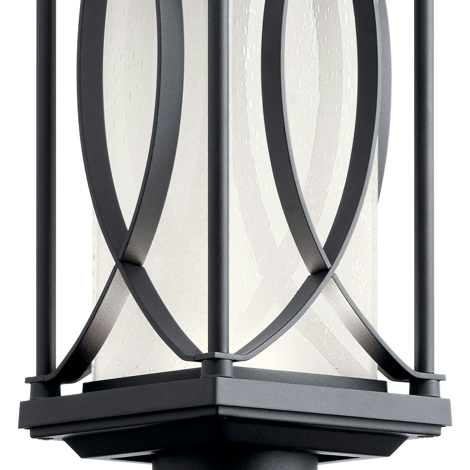 Close up view of the glass on the Ashbern outdoor post light 49976BKTLED