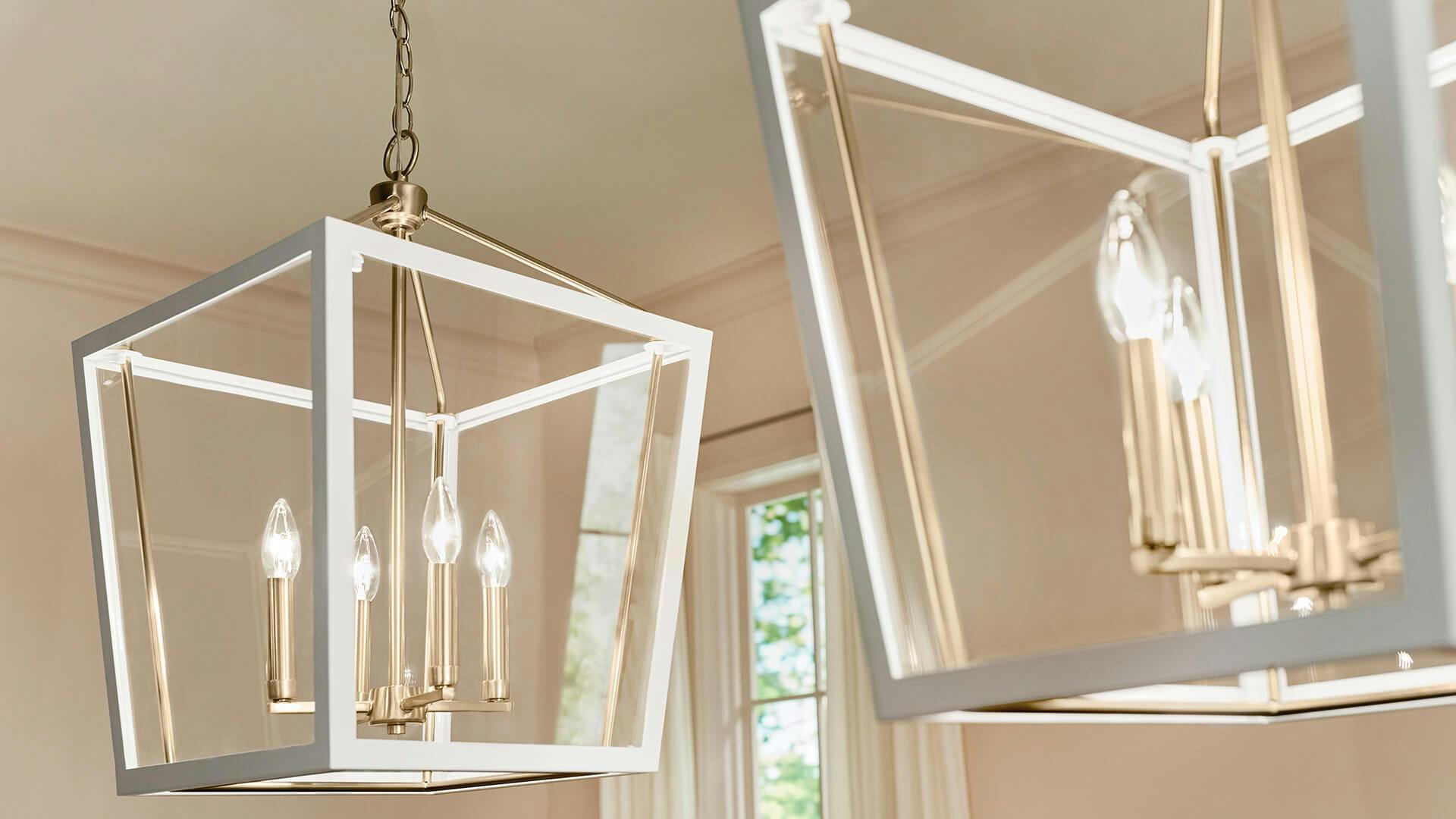 Two delvin pendant lights in white and gold finish hanging