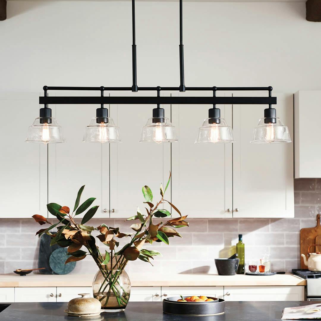 Day time kitchen with Eastmont™ 5 Light Linear Chandelier Black  and Walnut Wood