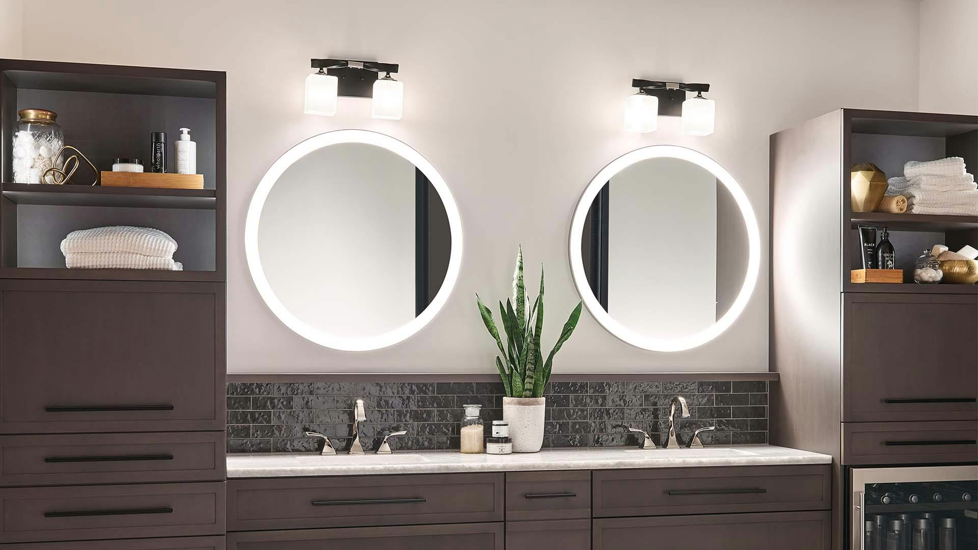 Bathroom with Marette vanity lights and Ryame mirrors.