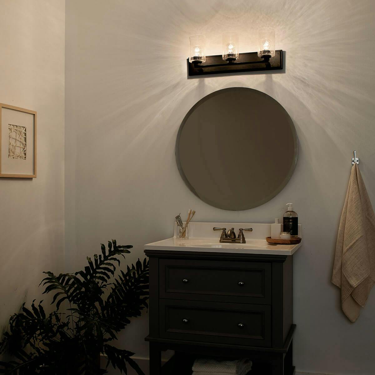 Night time Bathroom featuring Amity vanity light 37489BK