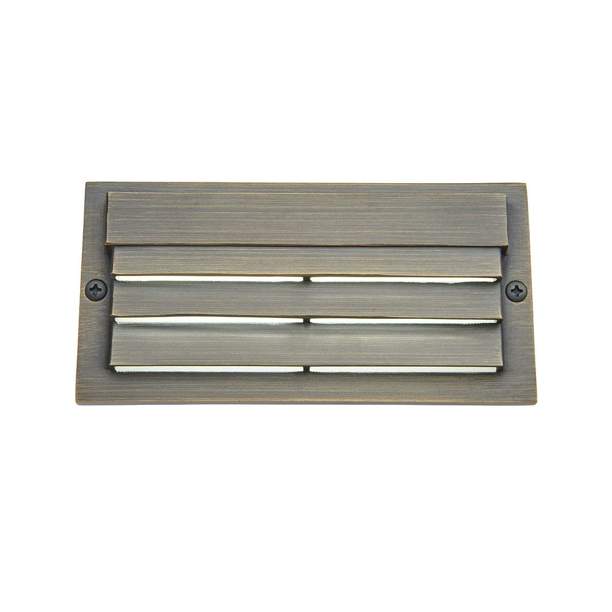 Front view of the 3000K Louvered Surface Step Light Brass on a white background