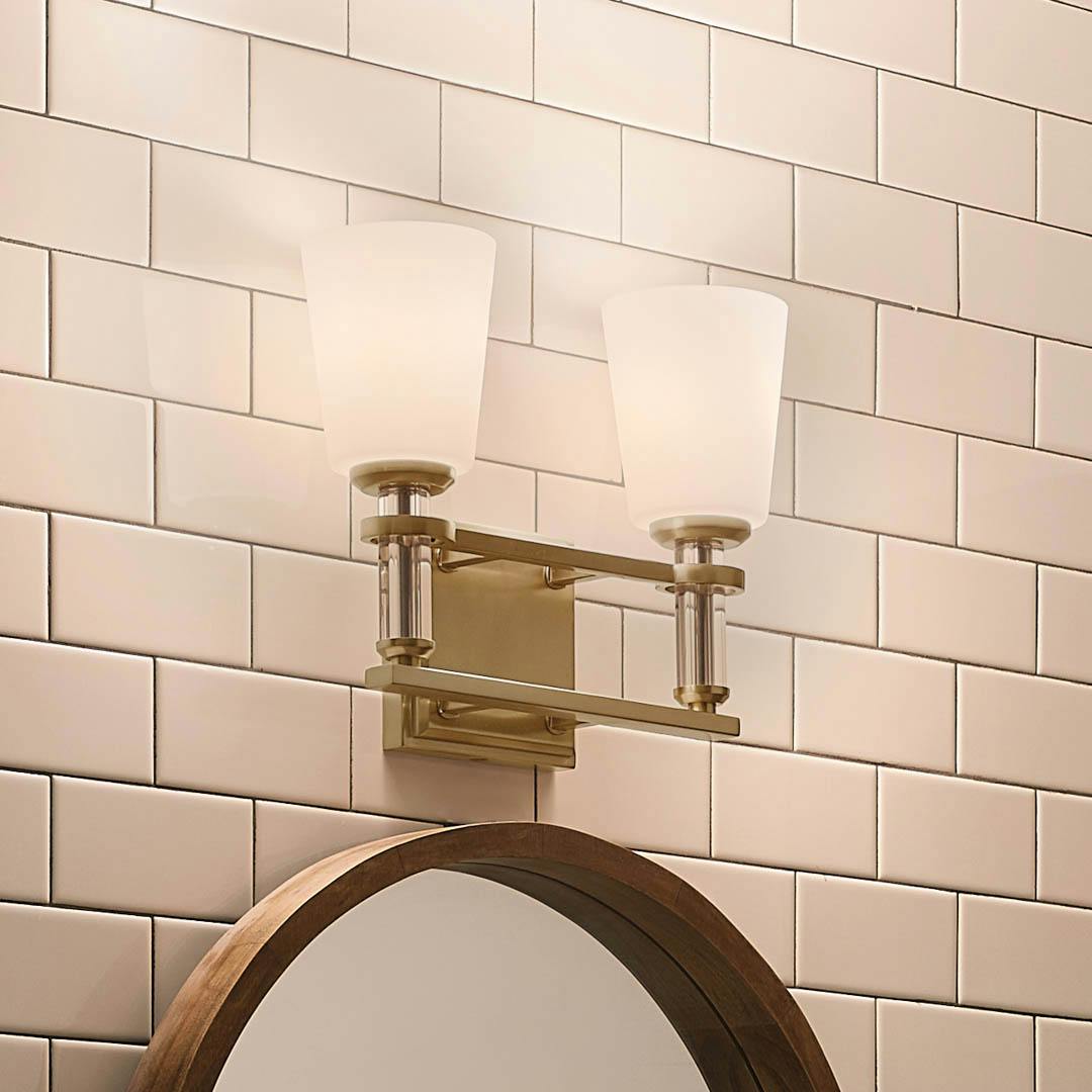 Night time bathroom with Rosalind 11.5" 2 Light Vanity Light Brushed Natural Brass