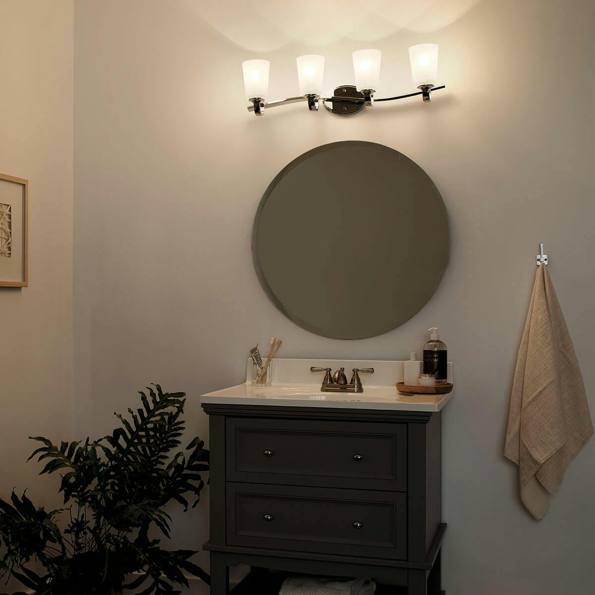 Night time Bathroom featuring Oxby vanity light 37517CH