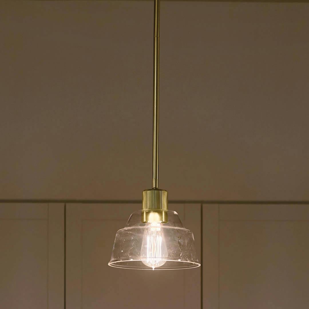 Night time kitchen with Eastmont™ 1 Light Mini Pendant Brushed Natural Brass