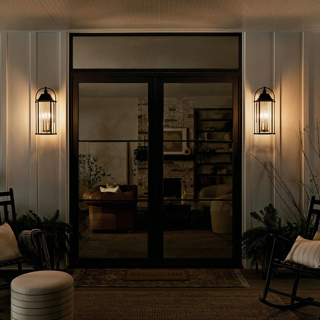 Home exterior at night with the Harbor Row 28.75" 4-Light Outdoor Wall Light in Textured Black