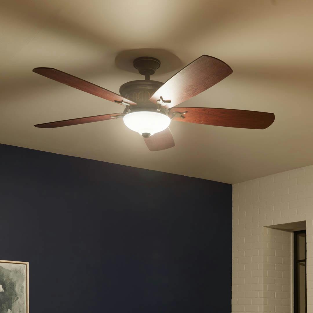 Night time living room with 56" Crescent 5 Blade LED Indoor Ceiling Fan Olde Bronze