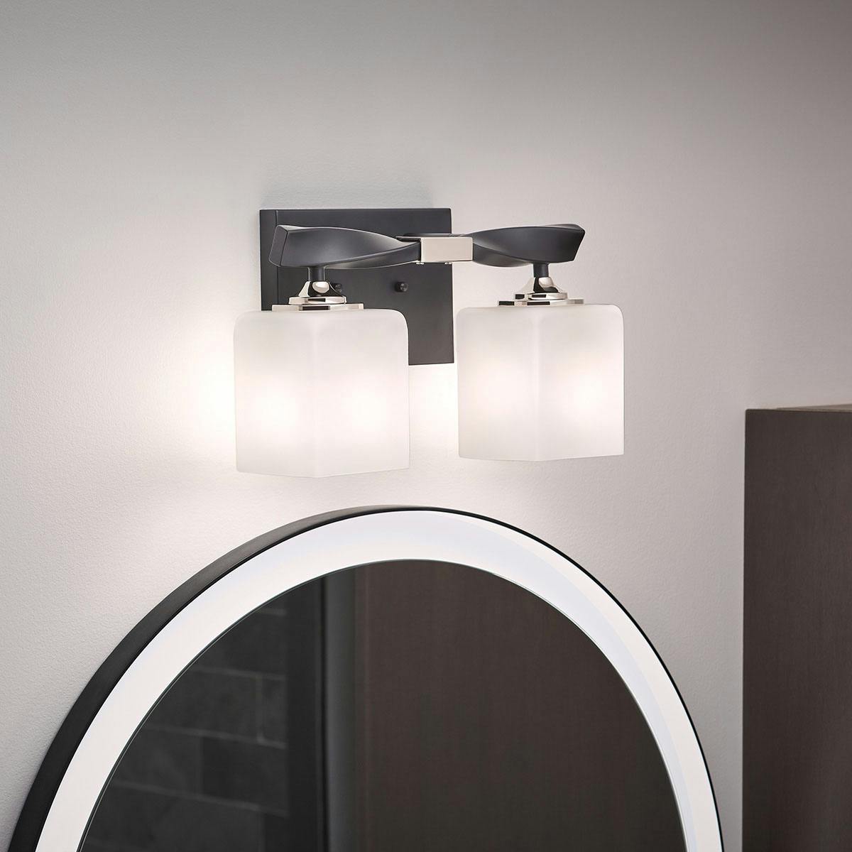 Night time Bathroom featuring Marette vanity light 55001BK