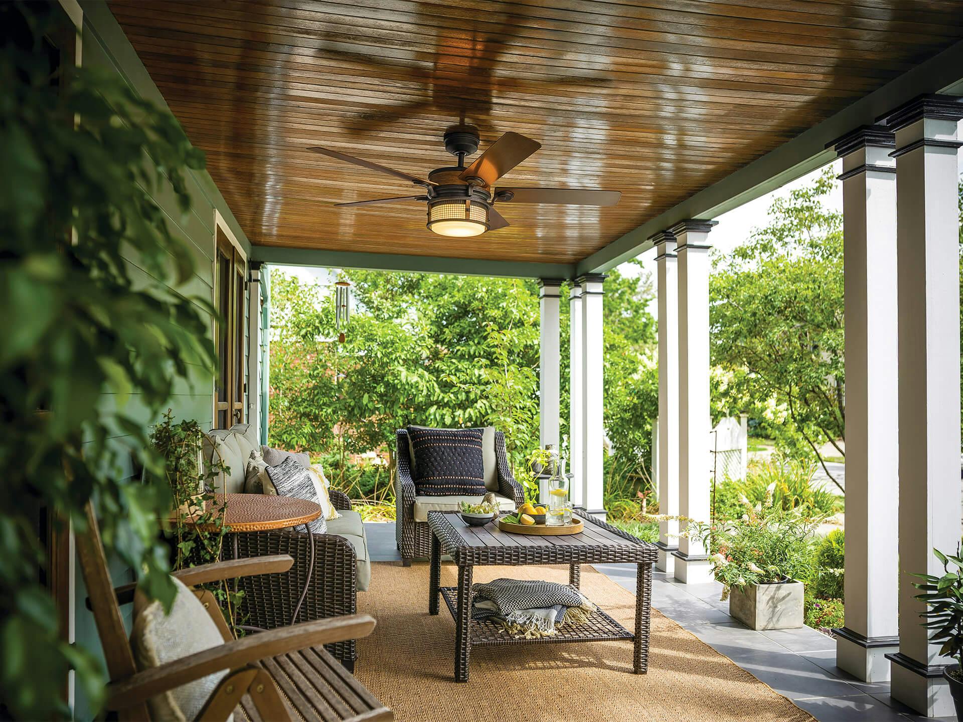 Ahrendale Outdoor Ceiling Fan in patio with lush greenery
