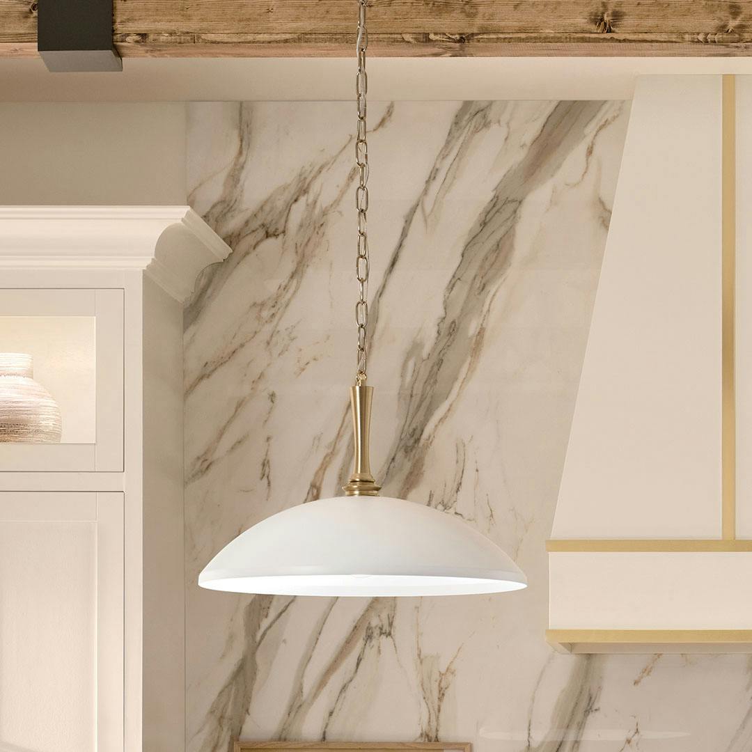 Kitchen in day light with the Delarosa 24 Inch 1 Light Pendant in White and Champagne Bronze