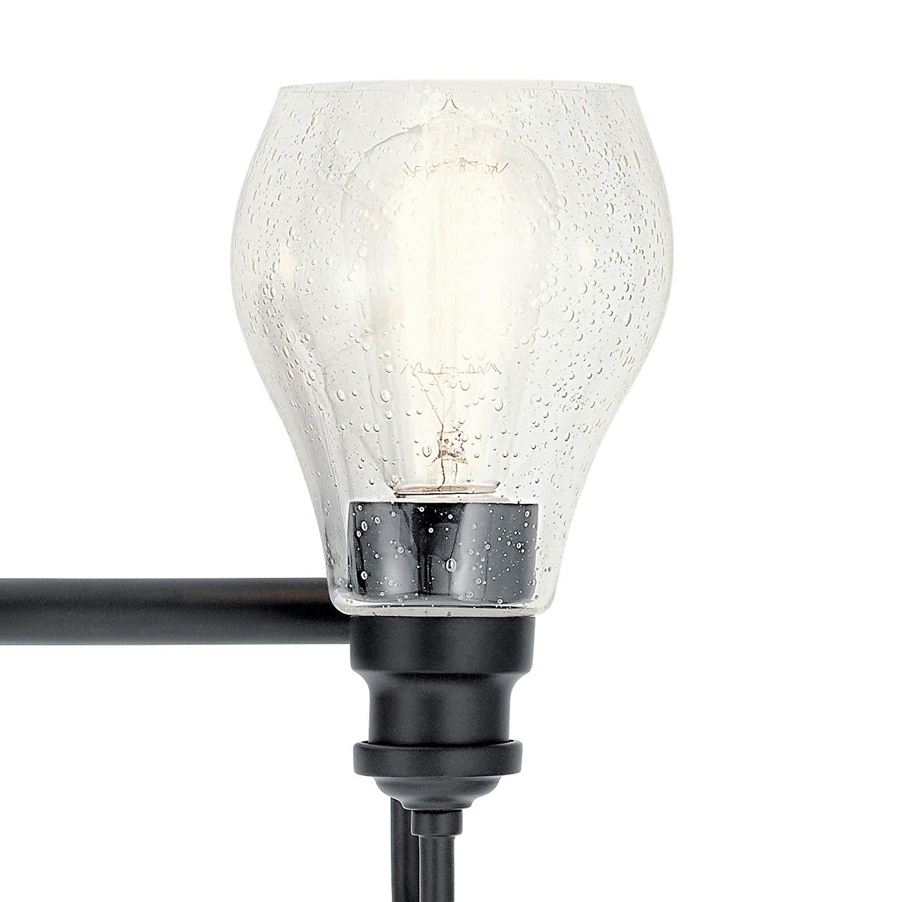 Close up view of the Greenbrier™ 3 Light Vanity Light Black on a white background