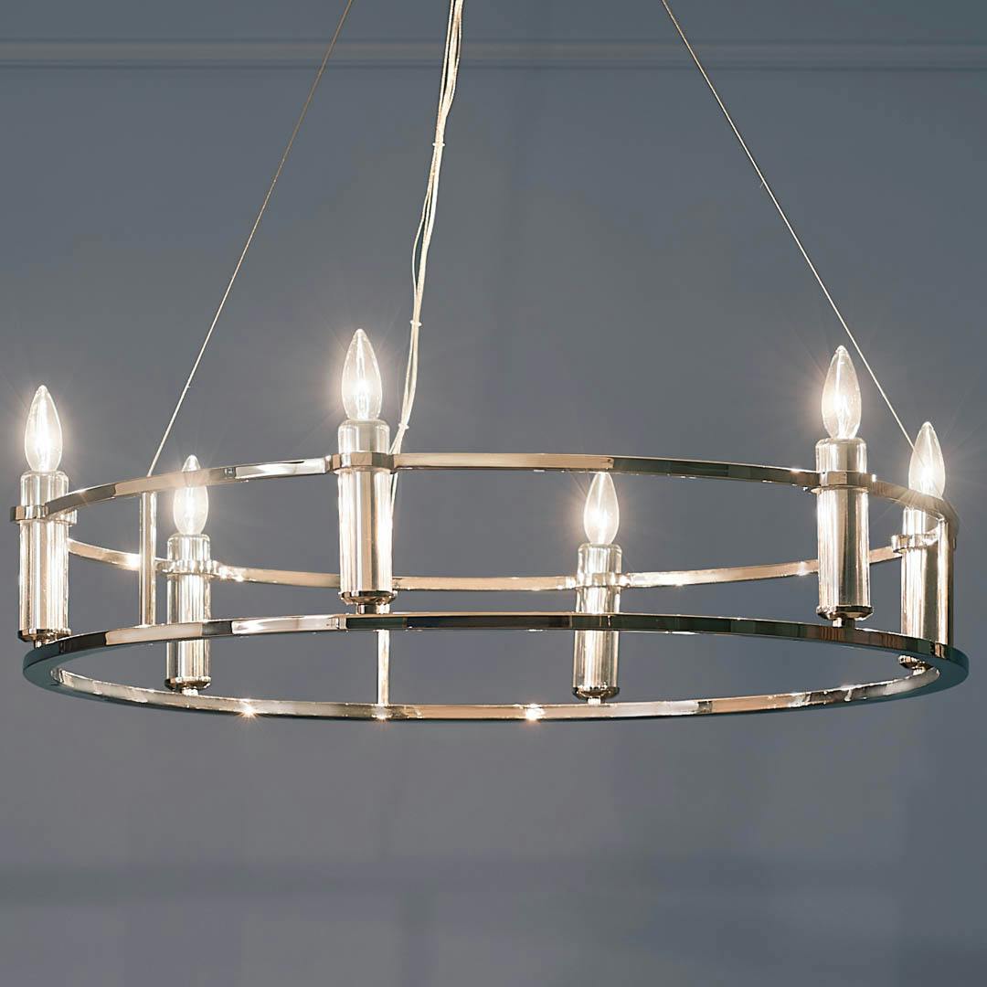 Night time dining room with Rosalind 33.25" 6 Light Chandelier Polished Nickel
