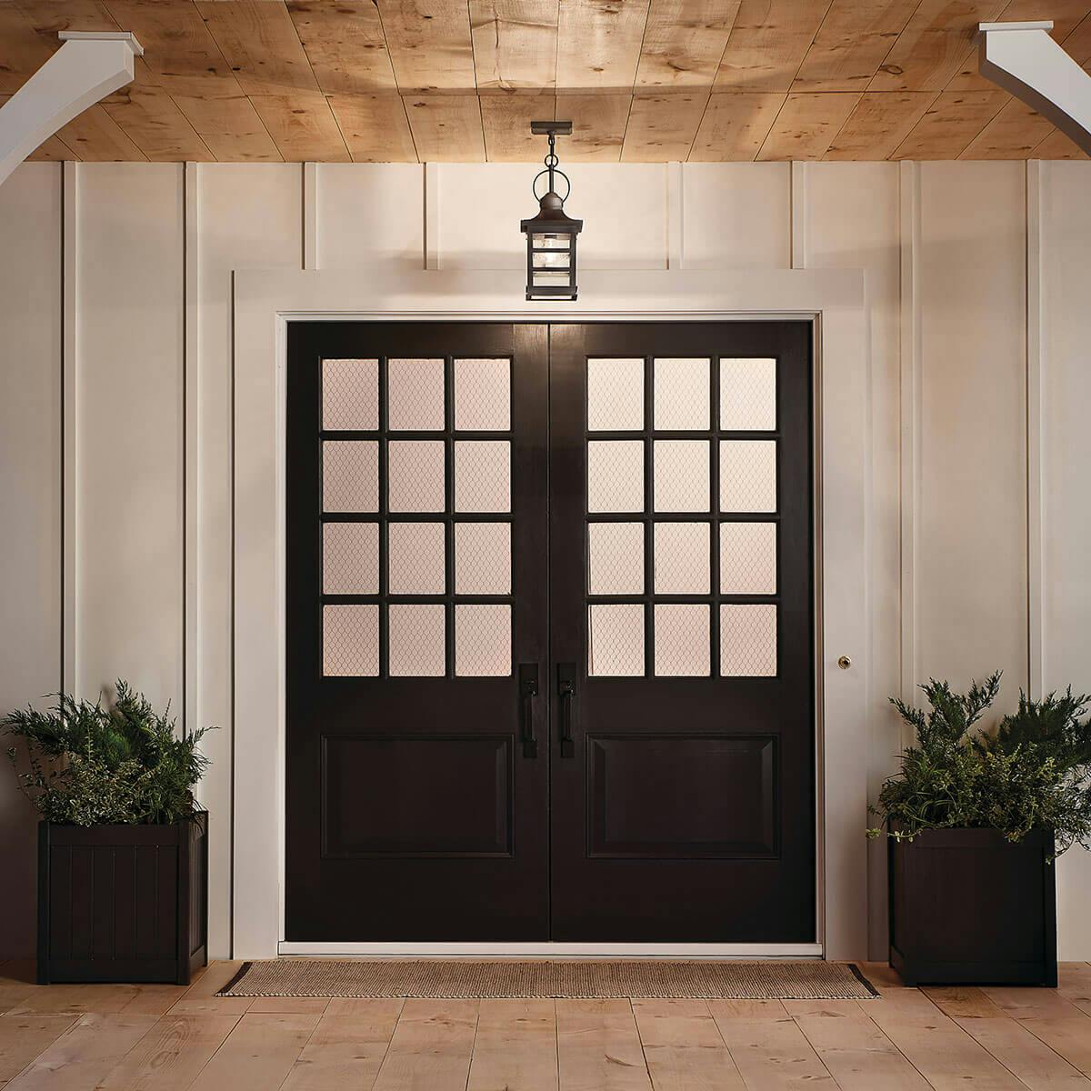 Night time outdoor entryway image featuring Grand Ridge pendant 39538