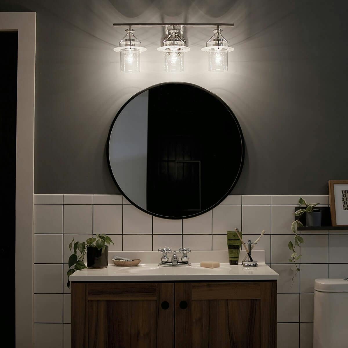 Night time Bathroom image featuring Everett vanity light 55079PN