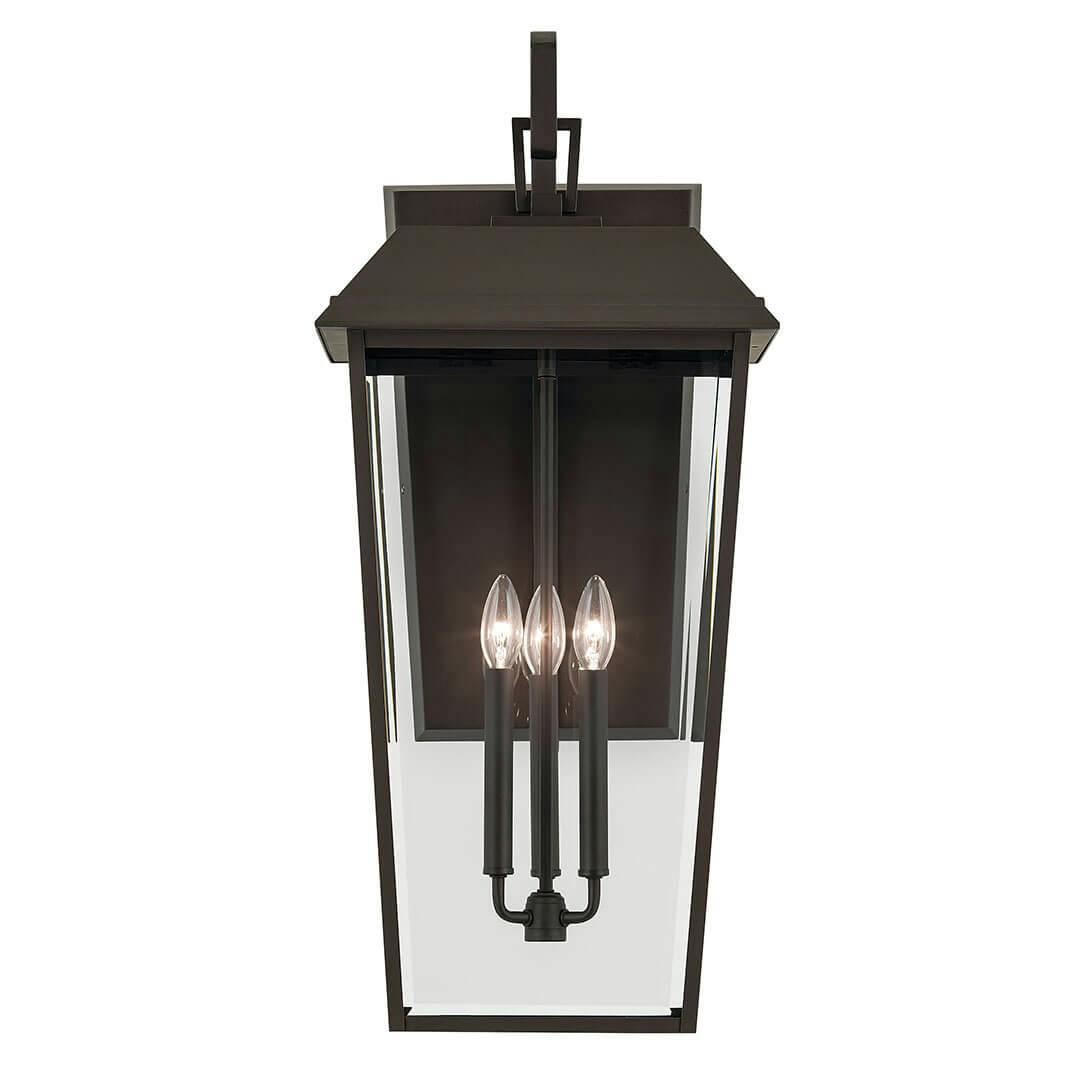 Front view of the Mathus 30.25" 3 Light Outdoor Wall Light with Clear Glass in Olde Bronze on a white background
