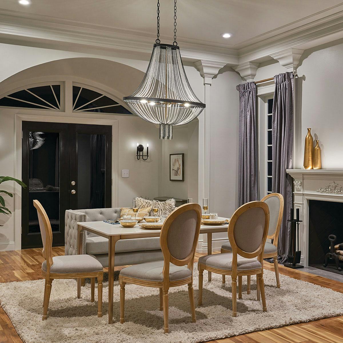 Night time dining room featuring Alexia 52408BKT and Capitol Hill 52308BK