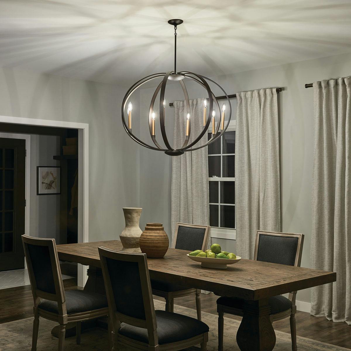 Night time dining room image featuring Elata chandelier 43872OZ