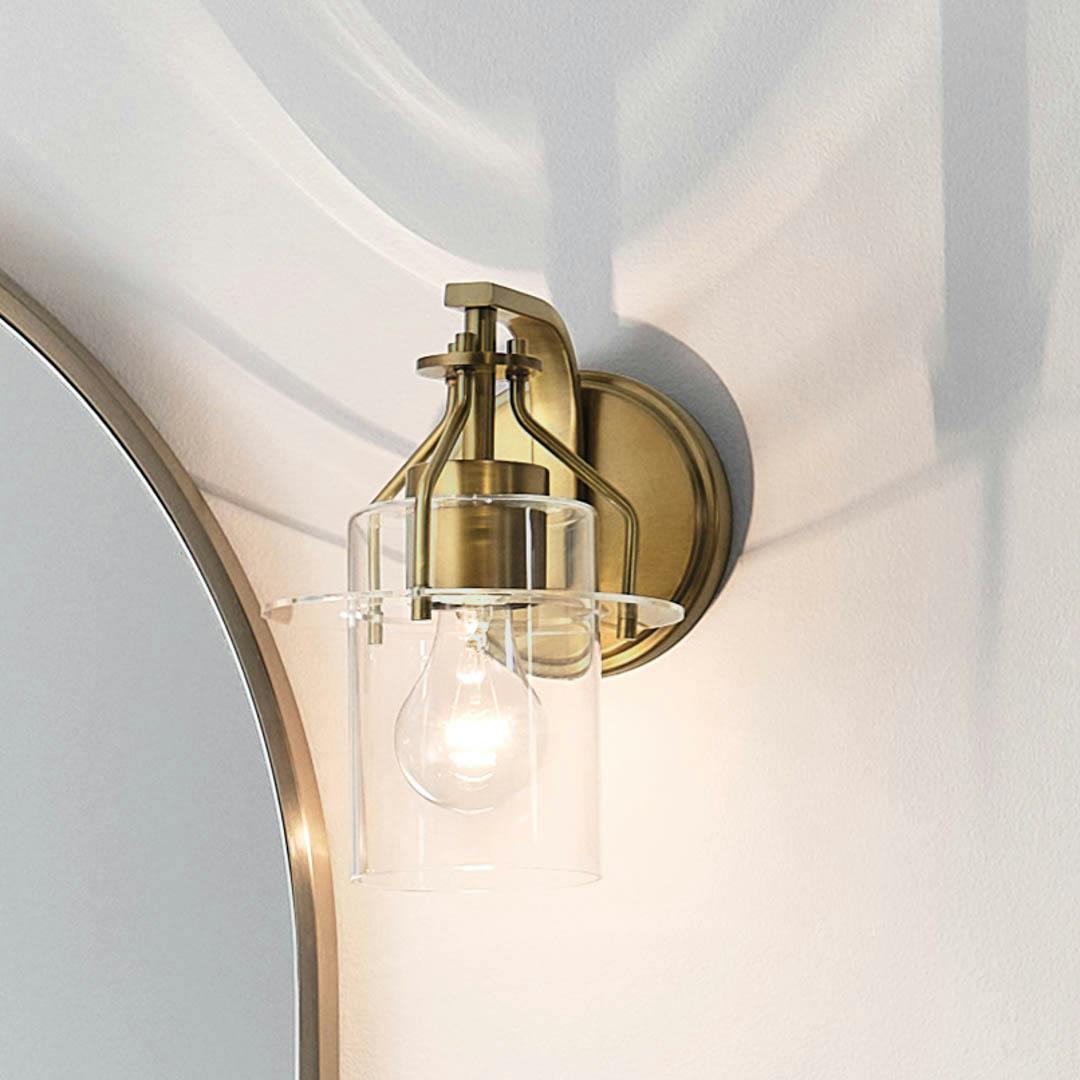 Day time bathroom with Everett 9.25 Inch 1 Light Wall Sconce with Clear Glass in Natural Brass