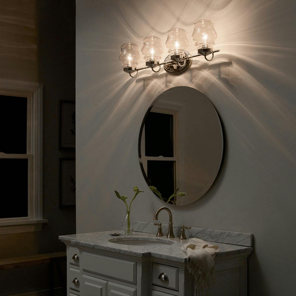 Night time Bathroom featuring Janiel vanity light 55040PN