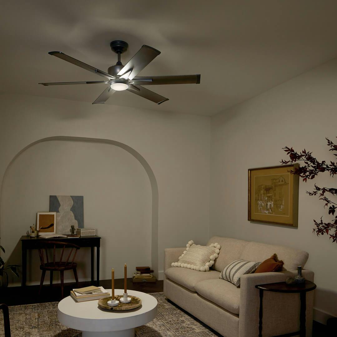 Night time living room with the Szeplo™ II LED 60" Fan Weathered Steel