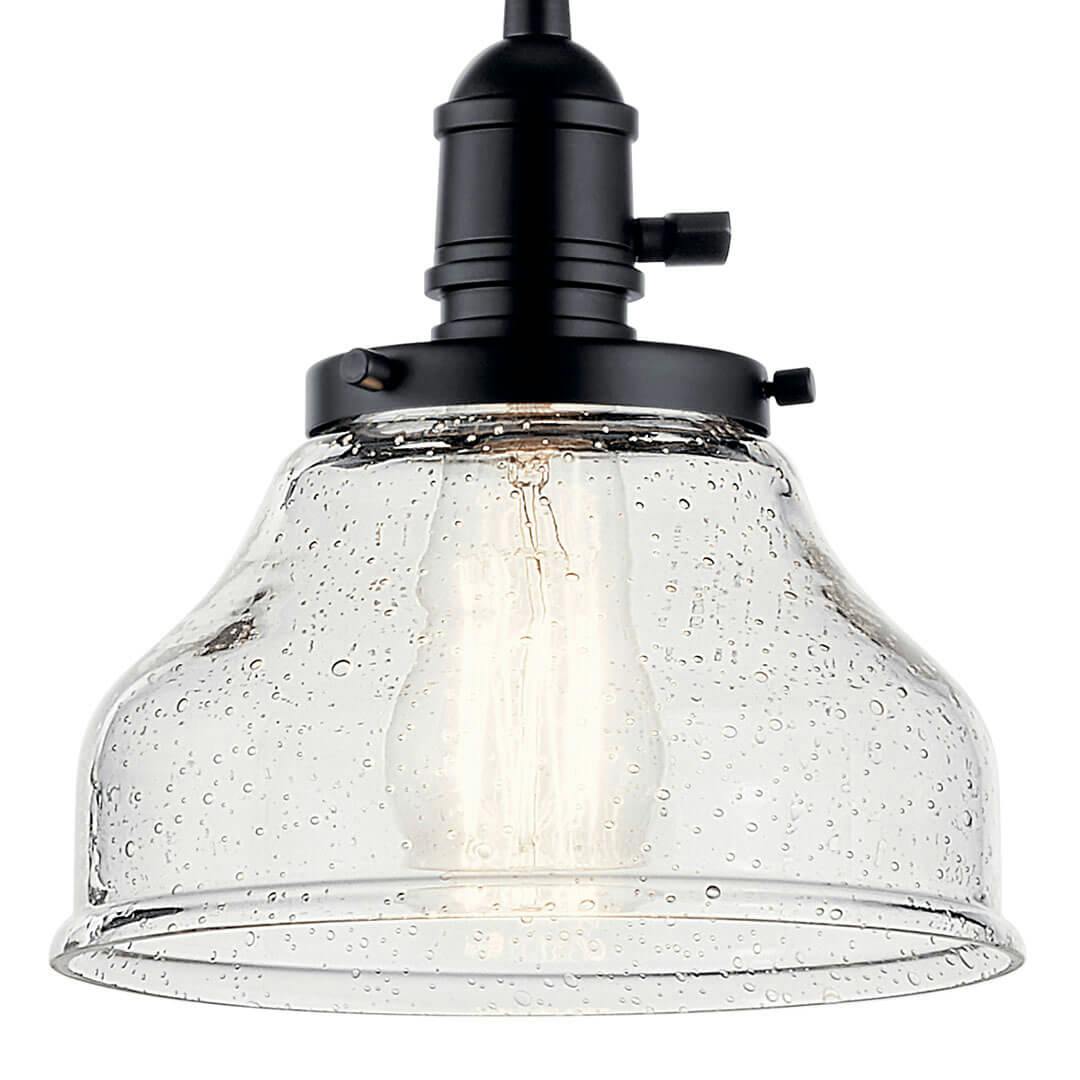 Close up of the Avery 8.5 Inch 1 Light Bell Mini Pendant with Clear Seeded Glass in Black on a white background