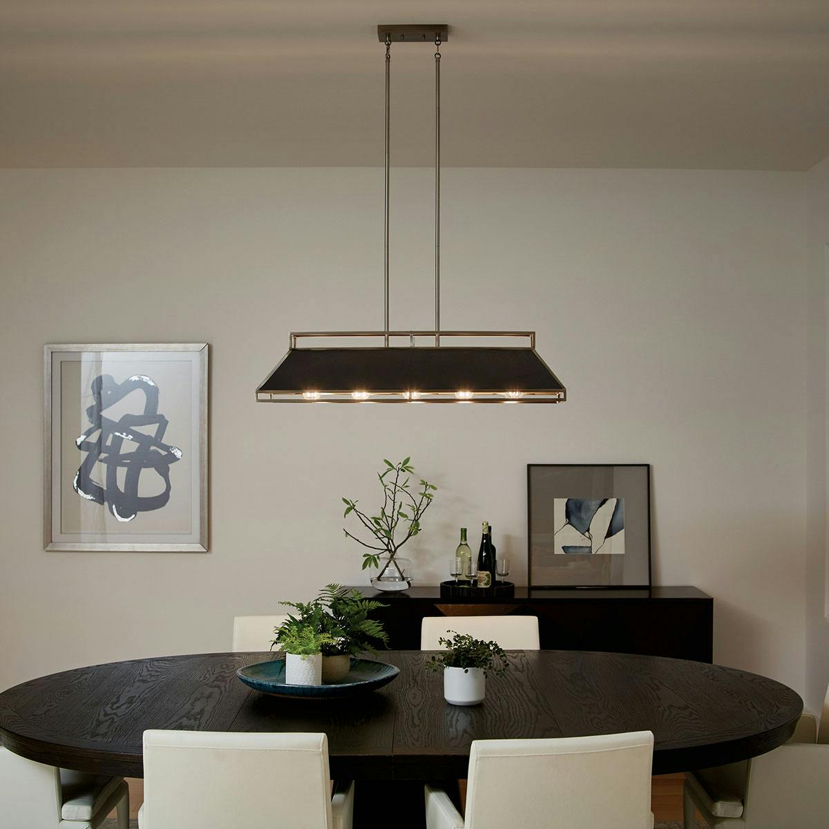 Night time dining room image featuring Grendel chandelier 52037CLP
