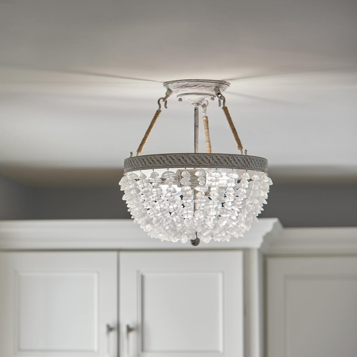 Close up view of the Kona Cay 12" Semi-flush Light in White on a white background