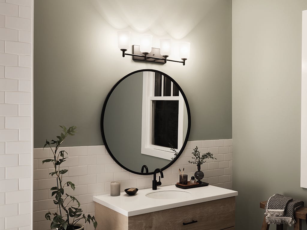 Night time bathroom with Shailene 29.75 inch 4 Light Vanity Light with Satin Etched Glass in Black