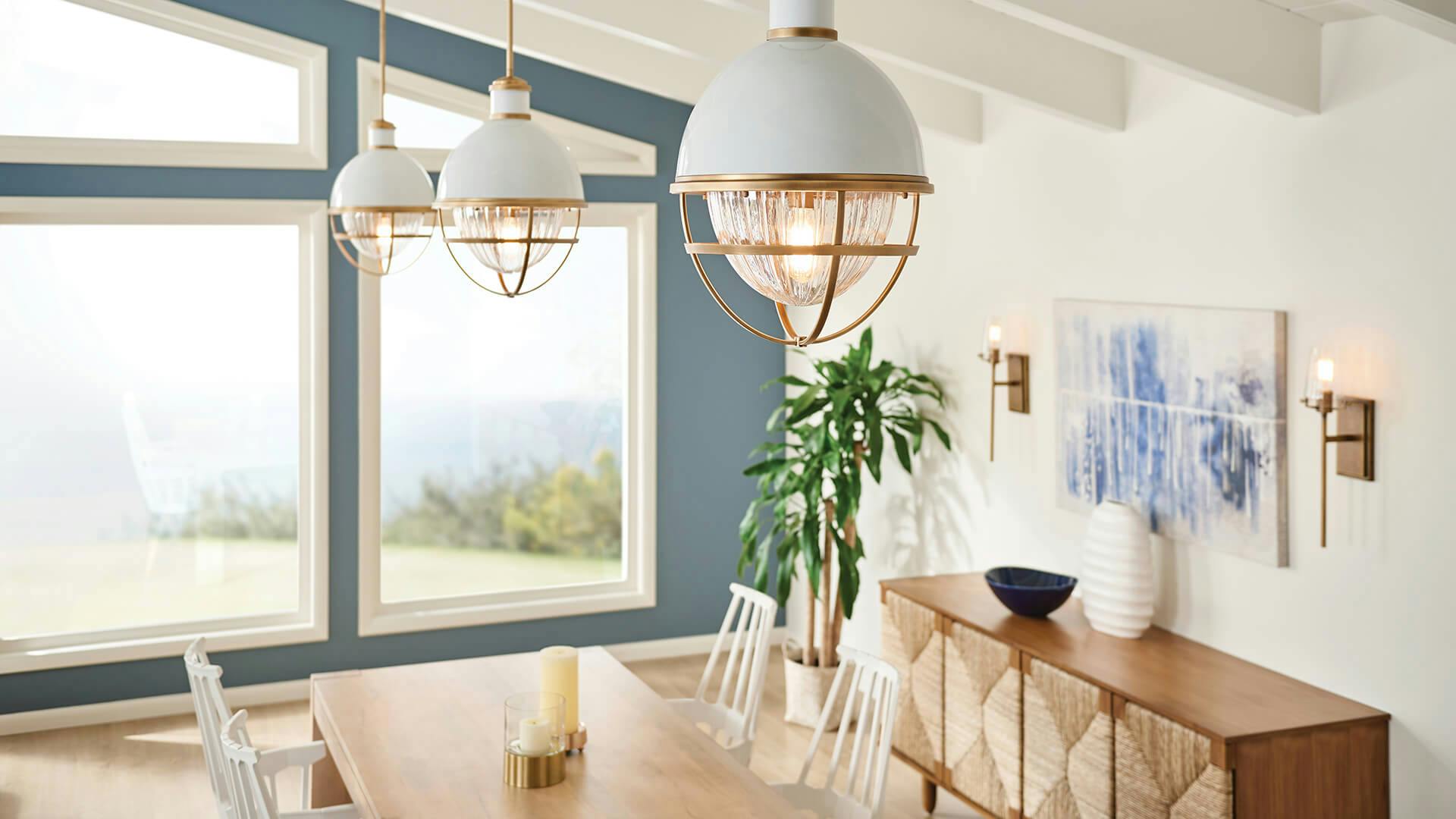 Dining room with three Tollis pendants during the day.