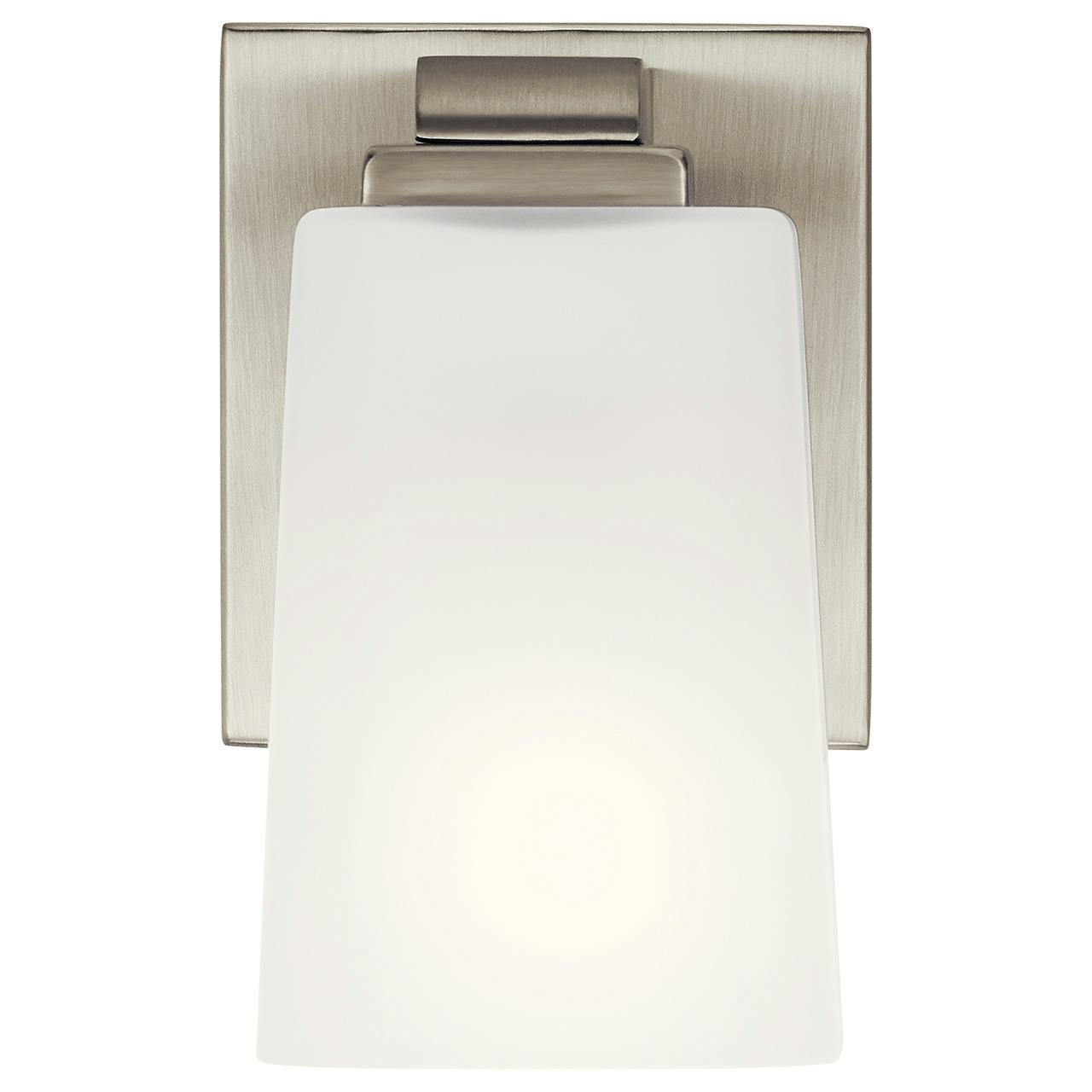 The Roehm™ 1 Light Wall Sconce Brushed Nickel facing down on a white background