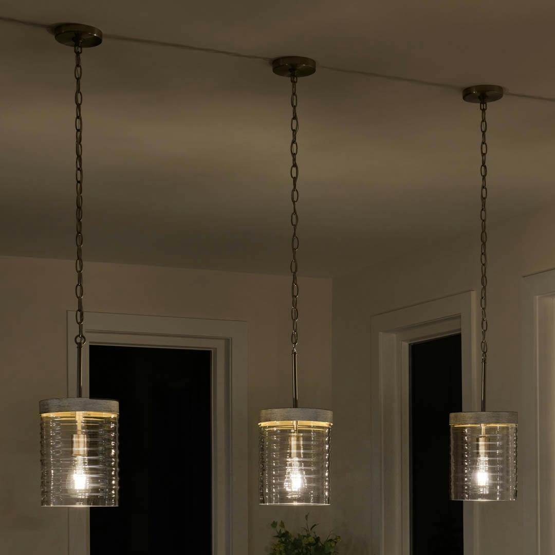 Night time kitchen with Maritime 1 Light Mini Pendant in Brushed Nickel and Distressed Antique Gray with Ribbed Glass