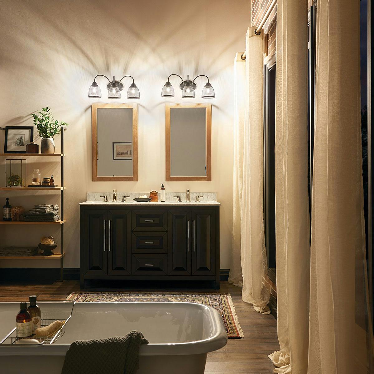 Nighttime Bathroom featuring Voclain vanity light 55043BK