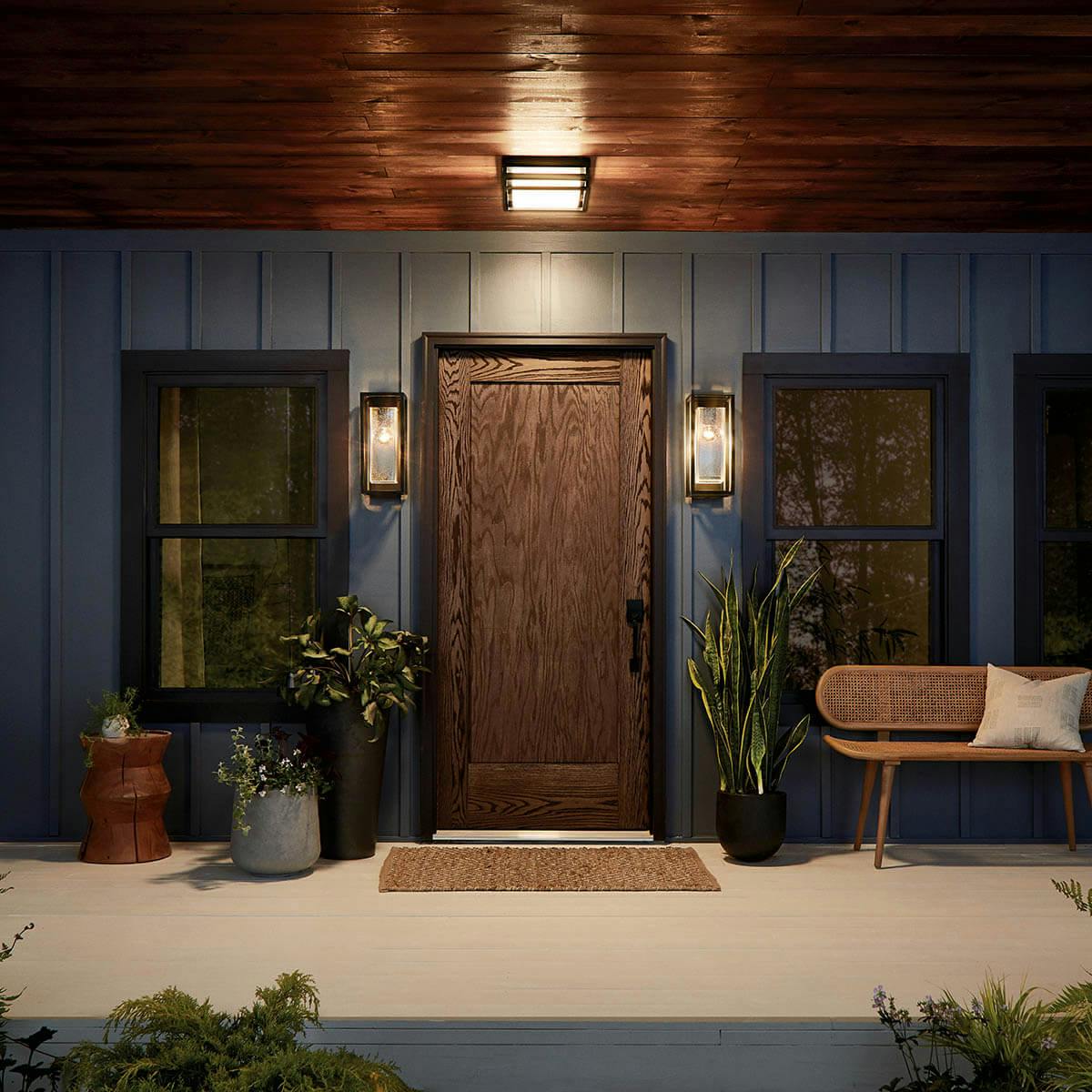 Night time Exterior with Mercer™ 16" 1 Light Wall Light Clear Seeded Glass Black