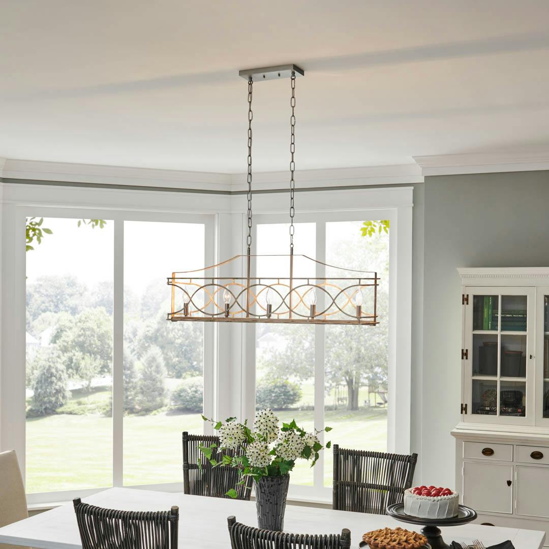 Day time dining room with Adelgade 5 Light Linear Chandelier in Distressed Antique White and Brushed Nickel