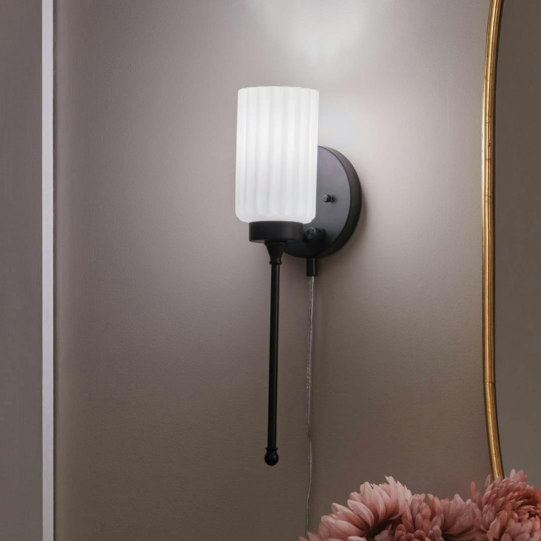Night time bedroom with Thelma 16 Inch 1 Light Plug-In Wall Sconce with Satin-Etched Cased Opal Glass in Matte Black