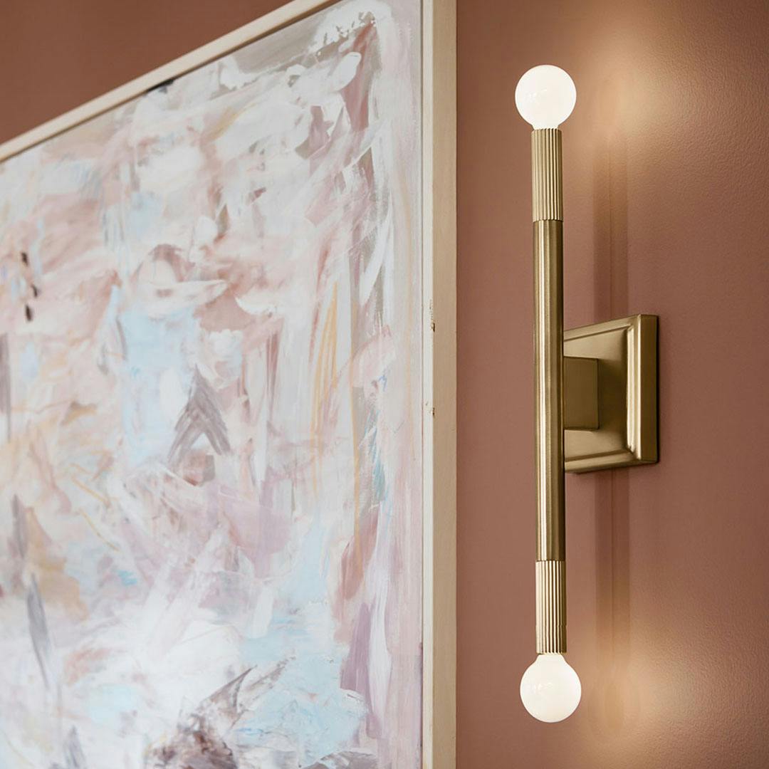 Day time dining room with the Odensa 17 Inch 2 Light Wall Sconce in Champagne Bronze